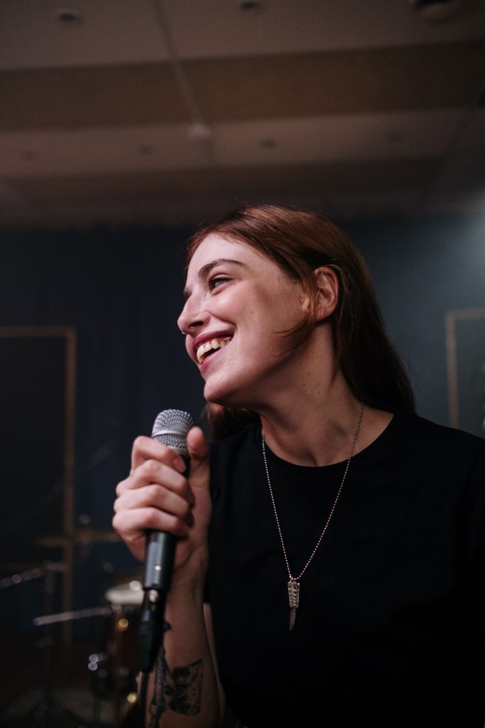 Smiling woman singing