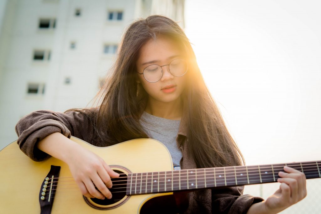 Girl playing guitar