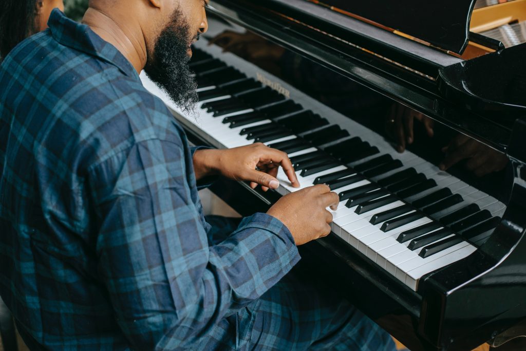 Man learning piano