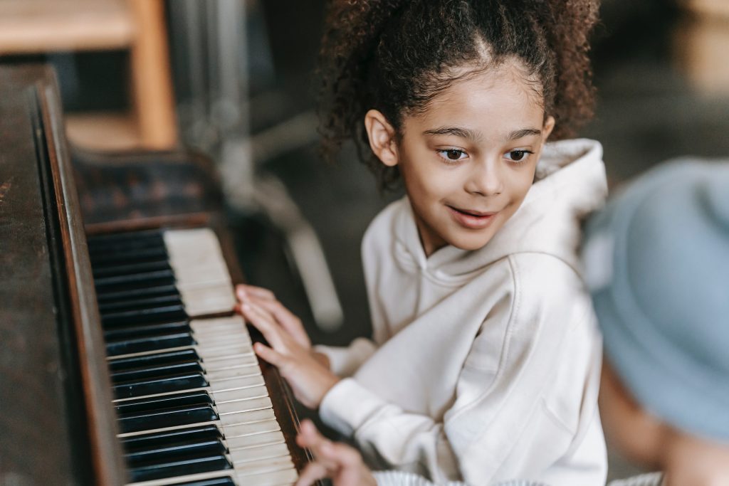 Child plays the piano